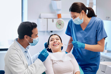 Woman, doctor and dentist with patient in clinic for consultation on medical advice hygiene for dental care or cleaning. Happy, people and orthodontics for teeth whitening or braces with treatment