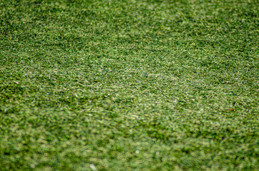 selective focus, detail of the texture of an artificial turf soccer field