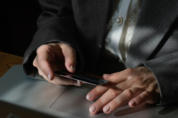 Paying online using plastic bank card.