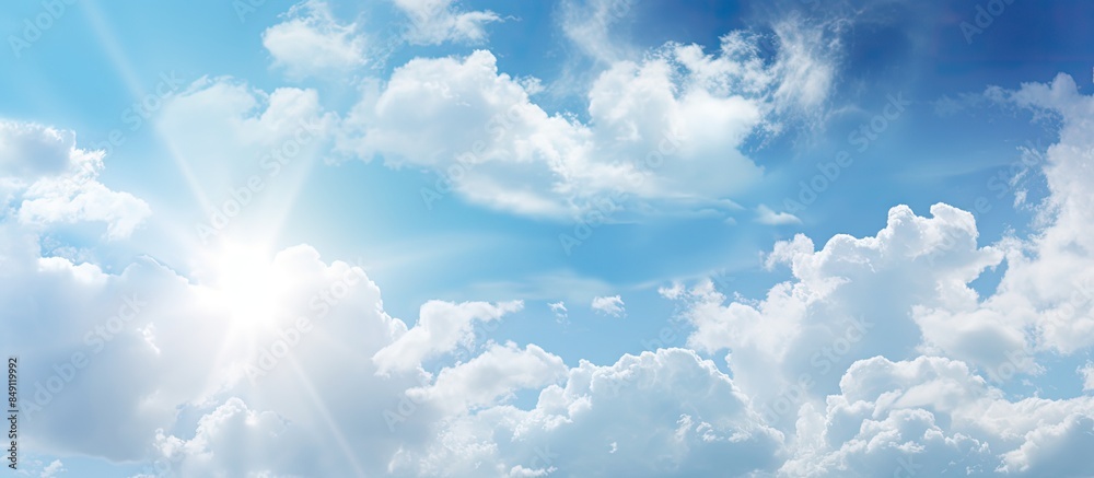 Poster out of focus view on the blue sky have light of the sun and gray clouds white cloud. creative banner