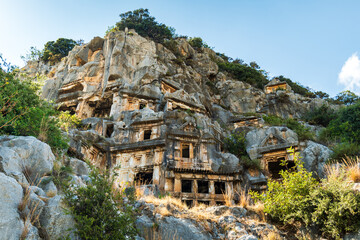 Naklejka premium Myra archaeological site with rock tombs in Demre, Turkey. The Ancient City of Myra is especially famous for its Lycian-Era rock tombs, Roman-Era theatre