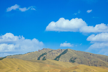 Aba, Sichuan Province - mountains and grasslands under the blue sky