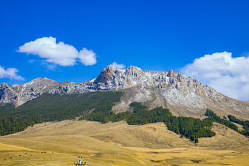 Aba, Sichuan Province - mountains and grasslands under the blue sky