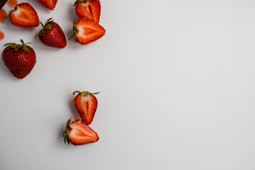 A view of the cut strawberry pieces. Free space for text on a white background.