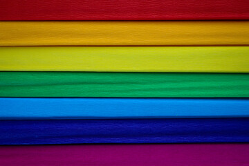 Colored paper in the shape of a rainbow. For backgrounds and presentations