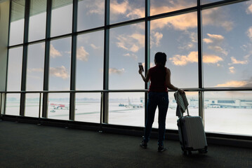 Fototapeta premium Female passenger waiting her flight at airport