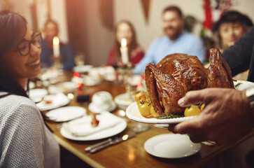 Dinner, hands and plate with turkey chicken in home with happy people for thanksgiving. Family, feast and smile with food for gathering or event with love, support and unity for care in dining table