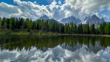 italian alps dolomites national park lake mountain trekking peaks tre cime brais lake carezza lake...