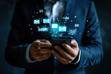 Businessman holding a phone with a message icons. Online communication and internet concept. Correspondence on social networks. Modern technologies.