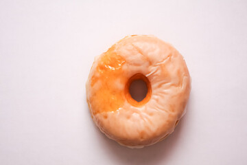 One donut placed on white background, top view