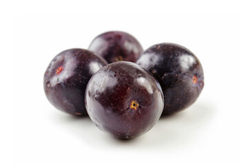 Fototapeta premium Closeup photo of a group of acai berries isolated on white