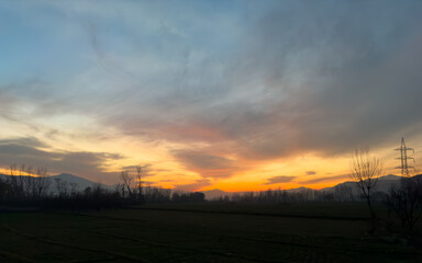 Beautiful sunset over the trees and fields in winter at swat valley, Pakistan.