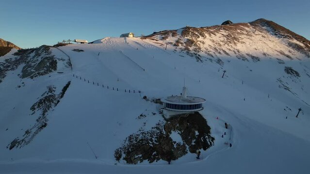 Aerial video over Coll blanc KSB ski resort, Andorra in a snowy winter