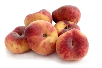 golden and red delicious peaches fruits close up