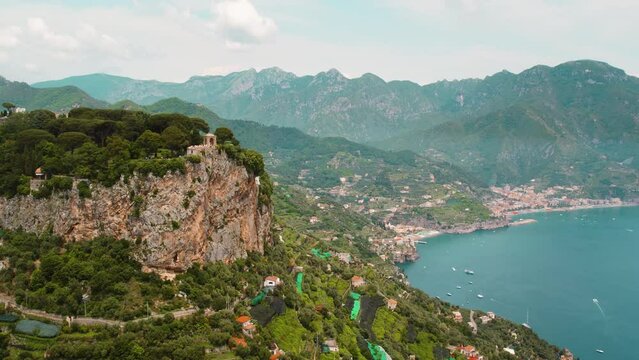 Aerial view of the coastline of Amalfi with cliffs and the sea in the background