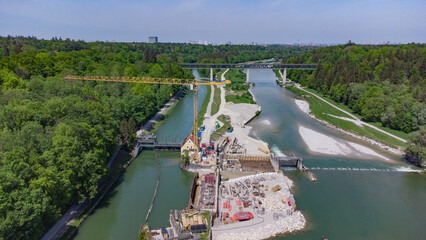 Top view of hydroelectric power plant aerial footage on the Isar river in Munich