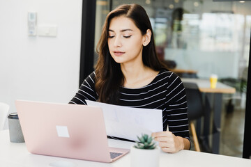 Young Happy Businesswoman Using Computer in Modern Office