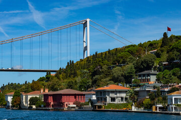 Istanbul Bosporus bridge view in the neighborhood of Usküdar with beautiful buildings in green scenery