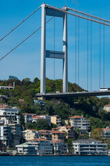 Fototapeta premium Istanbul Bosporus bridge view in the neighborhood of Usküdar with beautiful buildings in green scenery