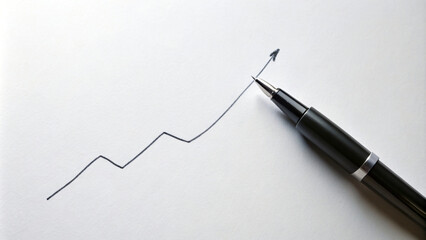 Fototapeta premium Business hand drawing a financial graph on a whiteboard with a pen, planning for success
