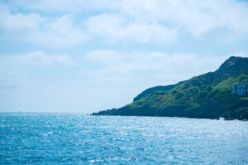 Fototapeta premium Dublin, Ireland - seaside under blue sky and white clouds