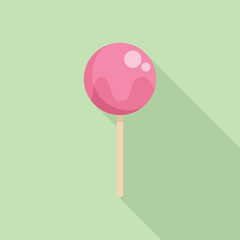 Pink lollipop is casting a long shadow on a green background, evoking sweet treats and childhood memories