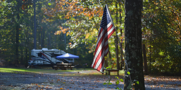 American flag in forest camping site