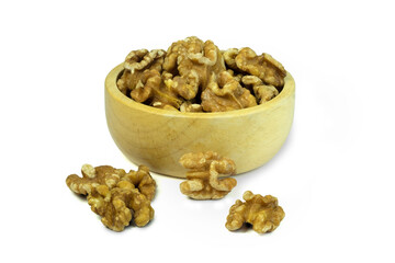 Roasted Walnut kernels in wooden bowl isolated on white background with clipping path closed up. Dieting food concept.