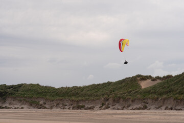 Paragliders flying above Donabate beach in Ireland, close to Dublin City.