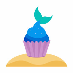 A cupcake with sparkling blue frosting and a mermaid tail topper rests on a sandy beach