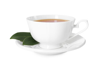 Aromatic tea in cup and green leaves isolated on white