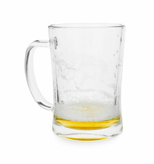 Almost empty mug of beer isolated on white