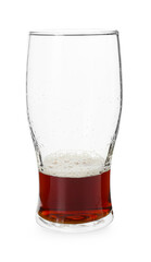 Almost empty glass of beer isolated on white