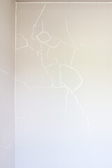 Repairing cracks on white walls