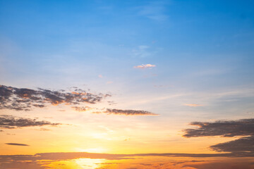 Fototapeta premium Beautiful , luxury soft gradient orange gold clouds and sunlight on the blue sky perfect for the background, take in everning,Twilight, Large size, high definition landscape photo