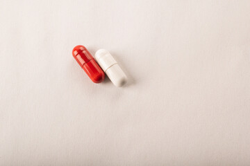 Pills. Medical pills and capsules. Red capsule. Isolated on a pink background. An allergy pill, antibiotics, supplements. Medicine, healthcare concept. Virus(viral), flu diseases. High quality photo