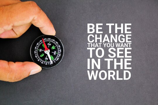 compass and motivational words Be the change, that you want to see in the world. the concept of self-motivation. the concept of motivation for self-change