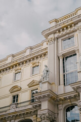 facade of a building with stone statues 