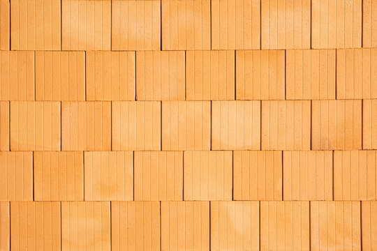 Walls from red clay ceramic bricks, new building of private house. Energy efficient wall  facade in europe architecture