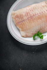 raw white fish fillet giant sea bass and filleting grouper fresh cooking appetizer meal food snack on the table copy space food background rustic top view Pescetarian diet vegetarian food