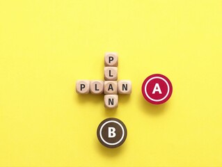 Wooden cube with text PLAN A and B. The choice of action plan. Business plan strategy, analysis, change of plan.