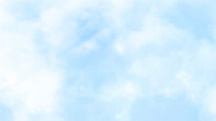 The sky has the light of the sun, the sky is blue, there are small and large clouds alternating and moving slowly, with the sunlight passing