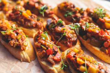 Beautifully decorated banquet catering table, with variety of with different food snacks appetizers on corporate birthday party event or wedding celebration, canape, salad, delicatessen setting