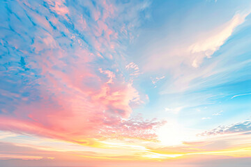 Beautiful pastel-colored sky with soft clouds at sunrise or sunset.