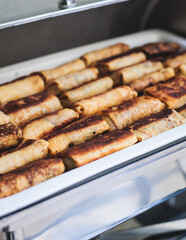 Set of coffee break in the hotel during conference meeting, with tea and coffee catering, decorated catering banquet table with variety of different pastry and bakery, with croissants and cookies