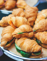 Set of coffee break in the hotel during conference meeting, with tea and coffee catering, decorated catering banquet table with variety of different pastry and bakery, with croissants cookies