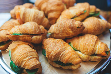 Set of coffee break in the hotel during conference meeting, with tea and coffee catering, decorated catering banquet table with variety of different pastry and bakery, with croissants cookies