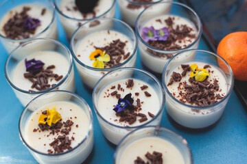 Beautiful multicolored decorated baked sweet tasty candy bar dessert selection with cake, pie and pastries selection, catering banquet table on kids children party, coffee break buffet at a conference