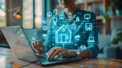 Person using laptop with smart home automation icons in a modern workspace