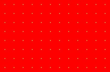 A red background with yellow dots